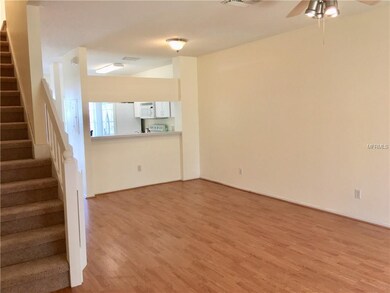 Dining area with wood laminate flooring.