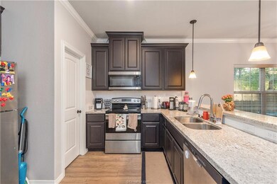 Kitchen with appliances with stainless steel finis