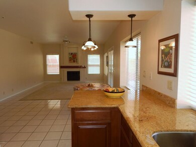 family room off kitchen with fireplace