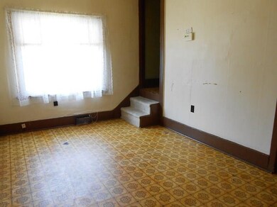 The stairway off the Dining Room leads to the uppe