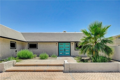 Property entrance featuring stucco siding and fren