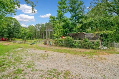 Driveway leading to the back of Property