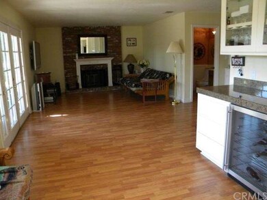 View from kitchen showing family room & built-in w