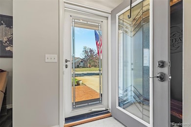 Doorway to outside with baseboards