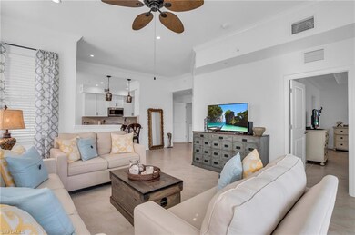 Tiled living room with ornamental molding and ceil
