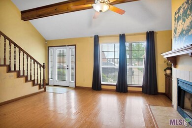 High vaulted ceiling, wood beam, wood burning fire