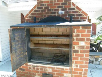 Other - Smoker behind outside brick, wood burning 