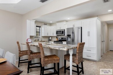 View of kitchen with island eating bar