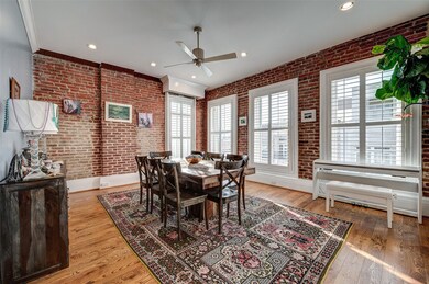 Exposed brick walls in the living and dining areas
