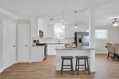 Kitchen island for additional storage, counter space, and seating.