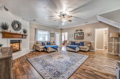 Living room with hardwood / wood-style floors, a f