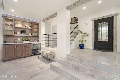 Wet bar off foyer in living