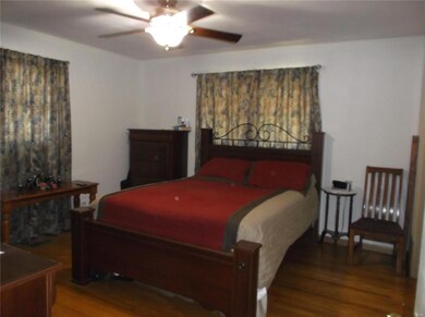 Nice sized master bedroom with hardwood floors