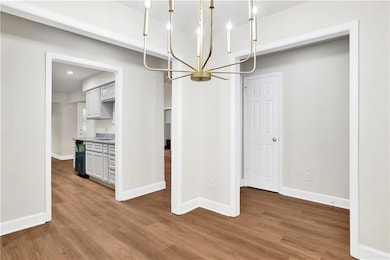 Unfurnished dining area featuring an inviting chan