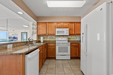 Kitchen featuring light tile patterned floors, a p