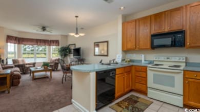 Kitchen featuring ceiling fan with notable chandel