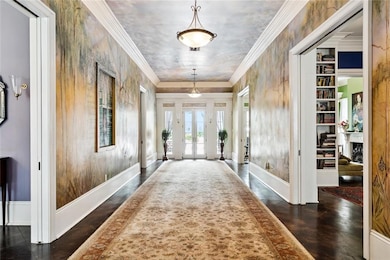 The center hall, high ceilings, crown molding, and floor plan were inspired by New Orleans’ Garden District mansions