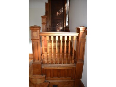 You can enter the stairway through the dining and living room.