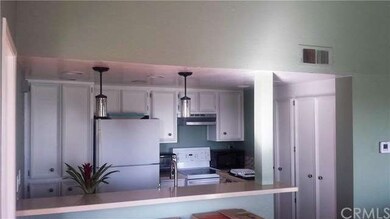 Newly painted cabinets and pendant lighting at bre