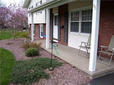 Exterior Front. Note the assorted plants and shrub