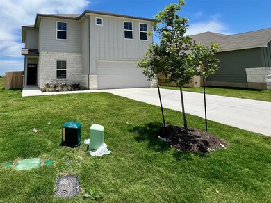 View of front of home with concrete driveway, an 