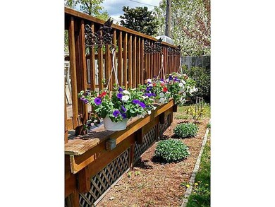 Exterior Front. Flower beds