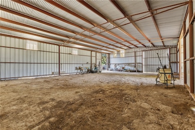 Garage featuring metal wall