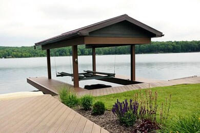 Covered cantilevered dock with lift.  Trex decking