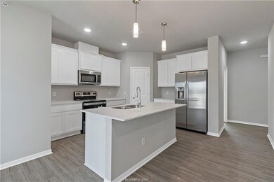 Kitchen featuring stainless steel appliances, sink