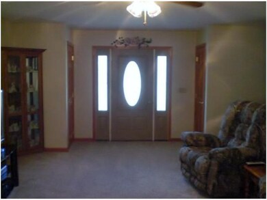 Living Room. Double coat closets and side lights s