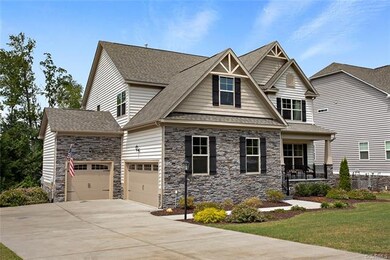Exterior front showing 2-car, side-entry garage an