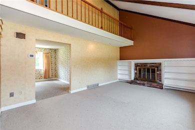 Living room with brick fireplace