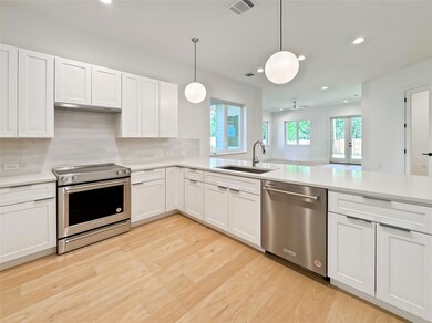 Kitchen featuring appliances with stainless steel
