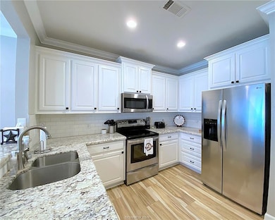 Kitchen with appliances with stainless steel finis