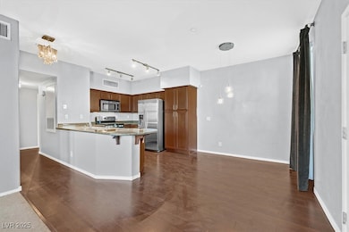Kitchen with a breakfast bar, appliances with stai