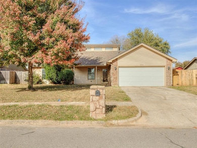 View of front of house featuring a porch, driveway, an attached garage, and roof with shingles