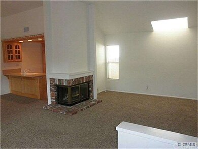 Fireplace and skylight in living room