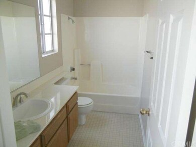 Master bathroom is spacious and features a tub for