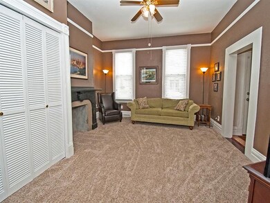 Two large windows in the living room bring in lots