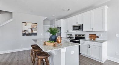 Kitchen featuring stainless steel appliances, ligh