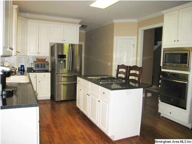Another view of kitchen showing eating bar.