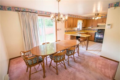 THE DINING ROOM IS OPEN TO THE LIVING ROOM AND THE