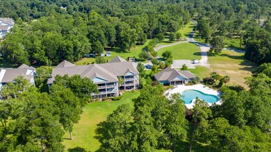 CONDO OVERLOOKS COMMUNITY POOL
