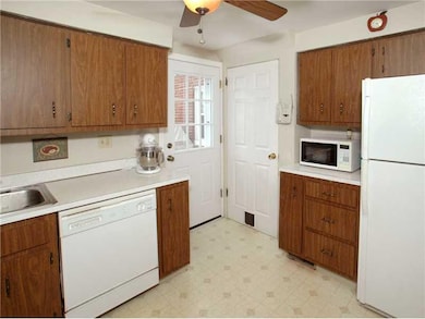 Kitchen. This view of the kitchen shows the new ba