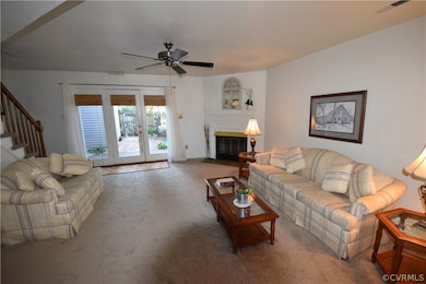 Spacious Living Room with fireplace. Brand new carpet throughout the house.