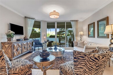 Tiled living room featuring crown molding