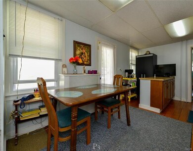 Kitchen eating area with door to side porch & yard