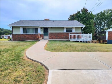 front of house with parking pad for two cars
