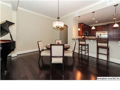 Open floor plan with crown molding and hardwood fl