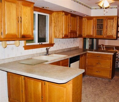 Generous sized kitchen with eating area on one sid